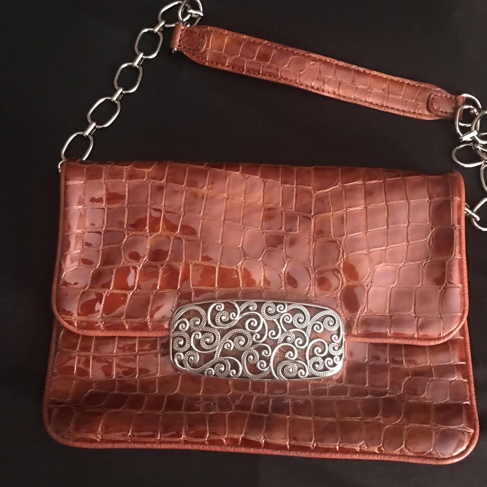 Carmel color purse with silver details.
